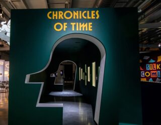 Chronicles of Time exhibition entrance with head silhouette design
