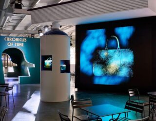 Modern museum exhibition with digital display and seating