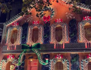Giant gingerbread house holiday decoration at night