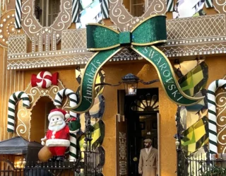 Ornate gingerbread house Christmas decoration with bow