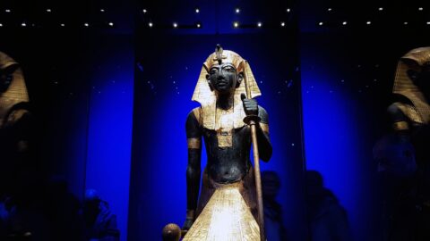 Ancient Egyptian pharaoh statue with gold headdress