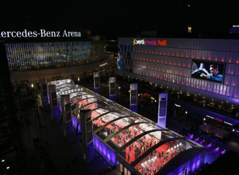 Laureus Awards illuminated glass pavilion at night outside Mercedes-Benz Arena Berlin