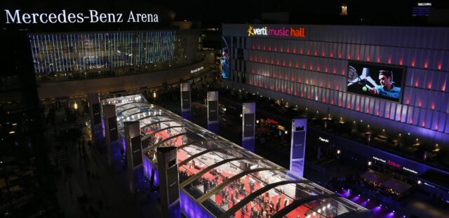 Laureus Awards illuminated glass pavilion at night outside Mercedes-Benz Arena Berlin