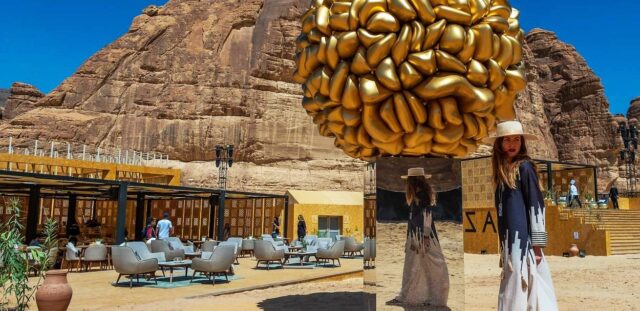 Giant golden brain sculpture in desert landscape with ancient rock formations