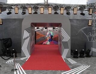 Red carpet event entrance with professional stage lighting
