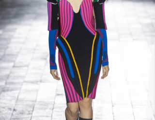 Model wearing colorful avant-garde geometric runway outfit