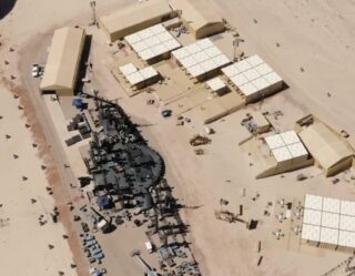 Military base with tent structures in desert