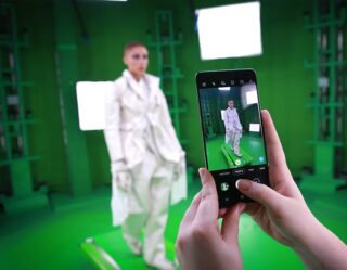 Samsung smartphone photographing model on green screen studio set