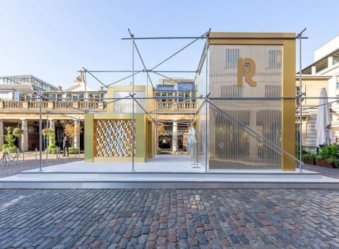 Gold and scaffold pop-up retail structure on Covent Garden cobblestones