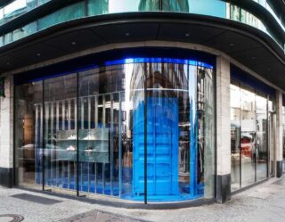 Modern storefront with striking blue glass entrance