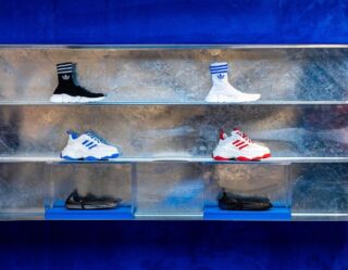 Display case with Adidas sneakers and socks