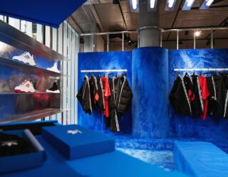 Modern retail clothing store with blue interior design