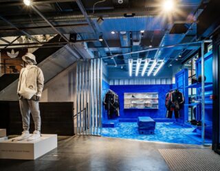 Adidas Originals retail installation with blue-lit product display zone