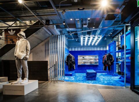 Adidas Originals retail installation with blue-lit product display zone