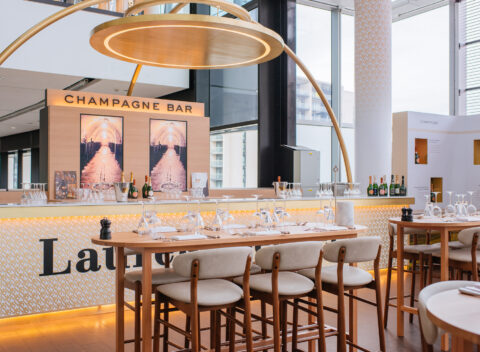 Elegant champagne bar with wooden seating and modern design
