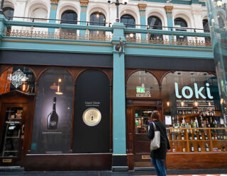 Storefront with turquoise facade and shop windows