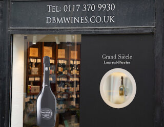 DBM Wines storefront with wine bottles displayed