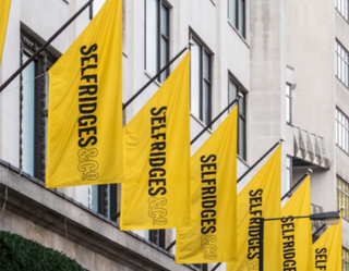 Yellow Selfridges banners on building facade