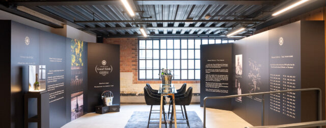Modern luxury brand showroom with black furniture display